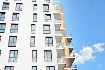 Multistory new modern apartment building. Stylish living block of flats.