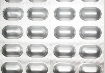 Tablets capsules in silver packaging pills for medicine design background