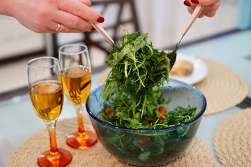 salad in a large bowl is mixed
