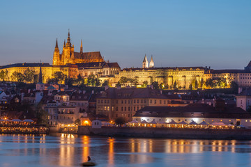 Fototapeta na wymiar Prague Castle and Charles Bridge in the evening, Prague, Czech Republic, Vltava river in foreground.
