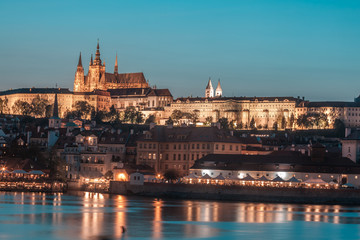 Prague Castle and Charles Bridge in the evening, Prague, Czech Republic, Vltava river in foreground.