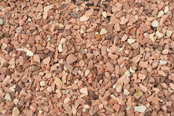 small stones of red-pink color, background, texture 