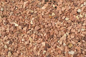 small stones of red-pink color, background, texture 