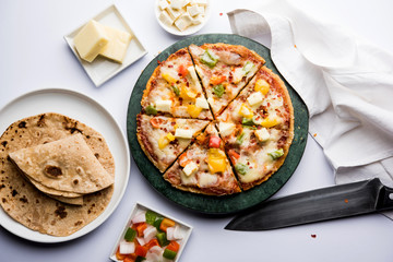 Chapati Pizza made using leftover Roti / Paratha with Cheese, vegetables, paneer and Sausage