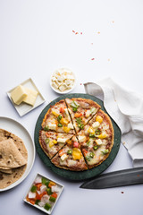 Chapati Pizza made using leftover Roti / Paratha with Cheese, vegetables, paneer and Sausage