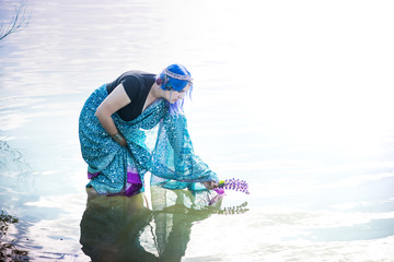 Girl in a sari near the lake