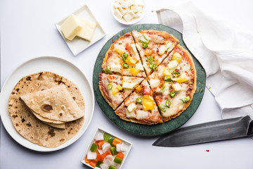 Chapati Pizza made using leftover Roti / Paratha with Cheese, vegetables, paneer and Sausage