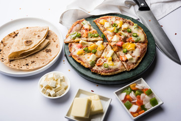 Chapati Pizza made using leftover Roti / Paratha with Cheese, vegetables, paneer and Sausage