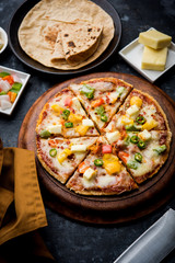 Chapati Pizza made using leftover Roti / Paratha with Cheese, vegetables, paneer and Sausage