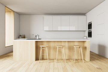White kitchen interior with bar