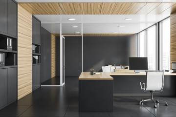 Gray and wood manager office with bookcase