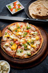 Chapati Pizza made using leftover Roti / Paratha with Cheese, vegetables, paneer and Sausage