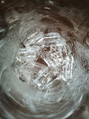 Tube ice in a glass of water