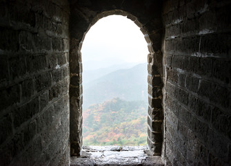 Archway of the Badaling section of The Great Wall of China, framing the hillsides, Yanqing, Beijing China.