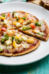 Chapati Pizza made using leftover Roti / Paratha with Cheese, vegetables, paneer and Sausage