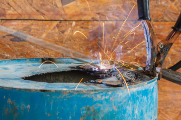 Spark light with welding Process with blue tube metal and bright sparks in steel