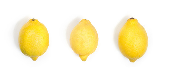 Three yellow lemons isolated on white background. Horizontal image.