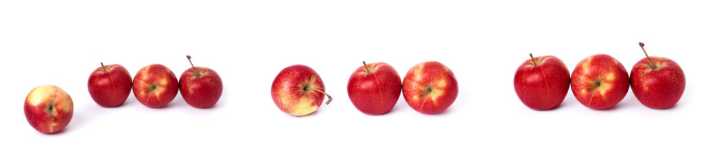 Set of red apples on a white background. Juicy apples of red color with yellow specks on a white background. The composition of juicy red apples