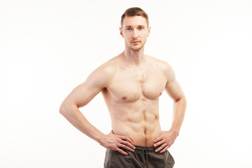 Fototapeta premium Mascular man standing straight looking at the camera.