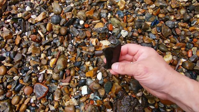 Slow motion of finding bone remains between stones.