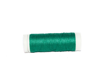 green thread spool, isolated on white background