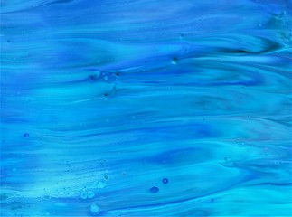 Turquoise abstract background with uneven pattern. Acrylic paints flow freely into one another,...