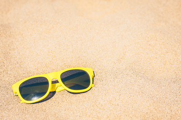 Fototapeta na wymiar Beach lazy vacation - the concept of plastic fashion glasses