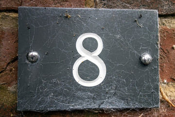 Written Wording in Distressed State Typography Found Number 8