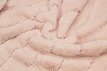Beige sheepskin rug background. Wool texture. Close up sheep fur