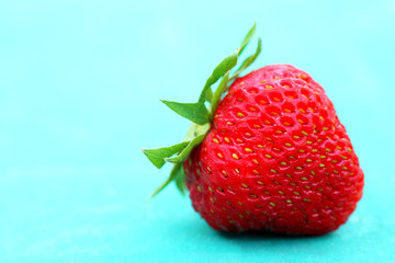 berry of strawberry on green background