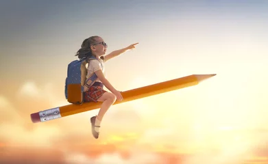 Deurstickers child flying on a pencil © Konstantin Yuganov