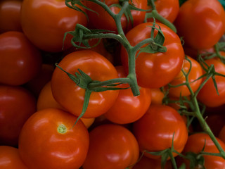 Closeup of red ripe cherry tomatoes at farmers market place