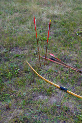 arrows and a bow on the ground