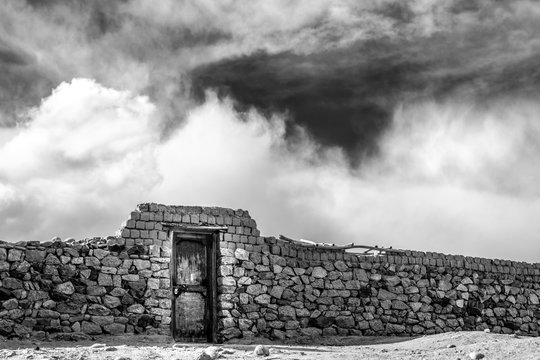 Abstract picture with stone wall and sky