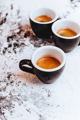 Three cups of freshly brewed espresso coffee
