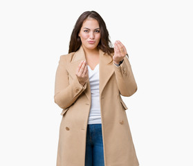 Beautiful plus size young woman wearing winter coat over isolated background Doing money gesture...