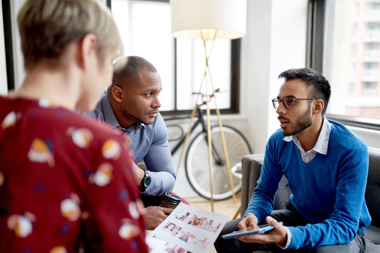 Indian Businessman Leading A Team Of Creative Millenials Collaborating On A Brainstorm Project