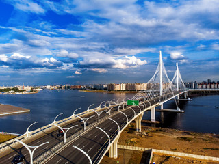 Fototapeta na wymiar Panorama of Petersburg. Highway. Stadium, western rapid diameter and cable-stayed bridge, view from quadrocopter drone flight