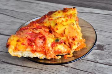Cheese pizza on wooden  background