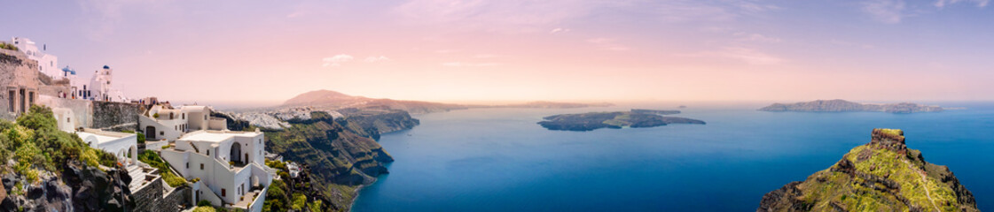 Fototapeta premium Panoramic view of Fira, the captial city of the famous greek island, Santorini, with the Skaros Rock on the right side.
