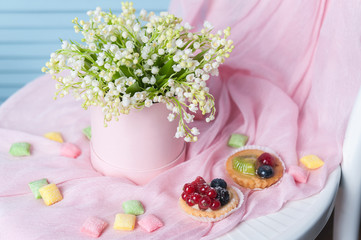 Beautiful Bouquet of flowers in a round hat box on a table