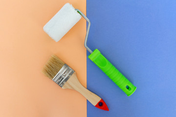 Painting brush and roller on colorful background. Preparation for repair