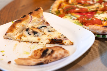 Pizza leftovers on a plate, pizza crust