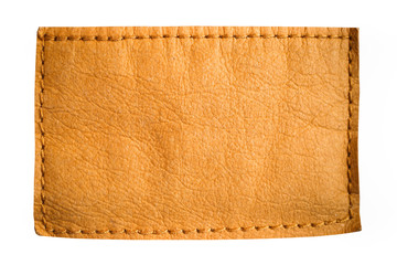 Blank jeans leather label tag in light brown yellow color with clear empty space for text or design...