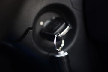 Old ignition key in the lock in On position. Automotive engine starting concept. Close-up.
