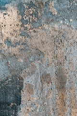 Naklejka premium Stylized banner with space for text. Blue and yellow surface texture decorative plaster. Grungy concrete wall with colorful lighting. Texture of old gray surface for background with blurred edges.