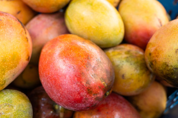 mango fruits in a basket at traditional marketplace