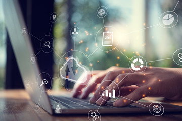 Big data analytics and business intelligence concept with chart and graph icons on a digital screen interface from laptop.Could computing concept.