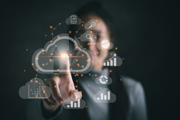 Big data analytics and business intelligence concept with chart and graph icons on a digital screen interface and a businesswoman in background
