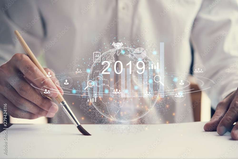 Poster man's han2019 new year planning business and financial concept.man's hand writing on paper with with